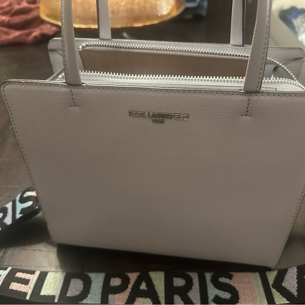 Pastel purple Karl lagerfeld handbag with guitar strap
